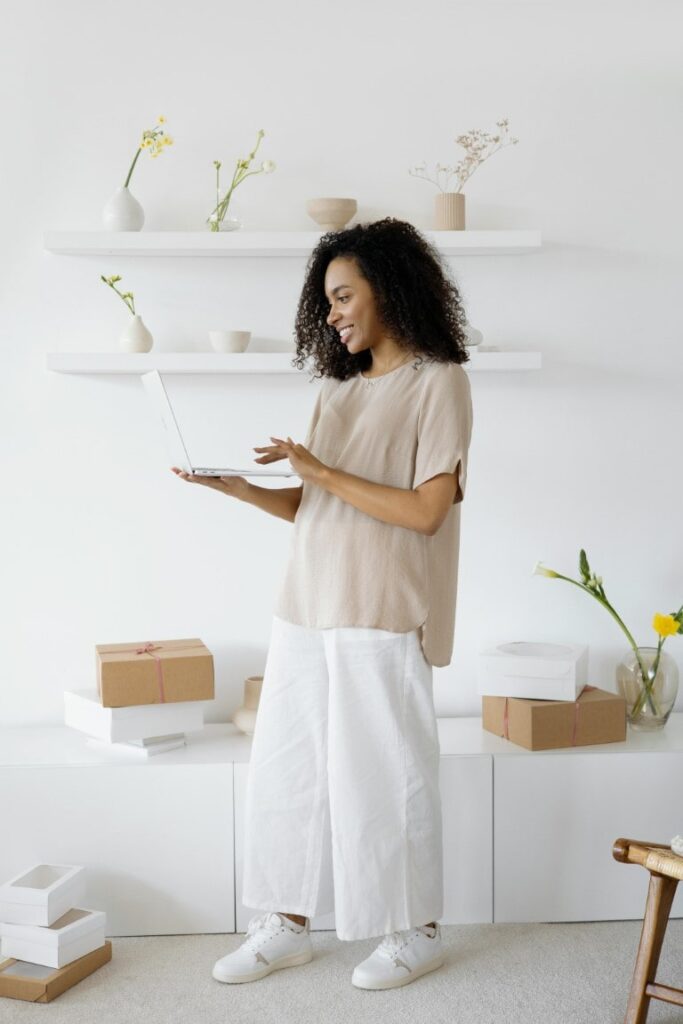Woman checking online business on laptop